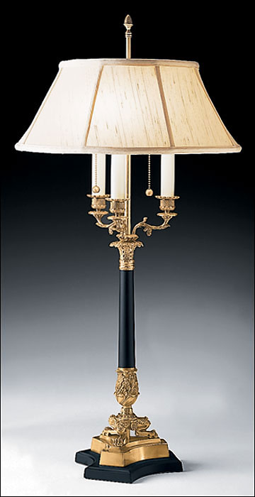 Three light antiqued brass table lamp with black trip and round lampshade